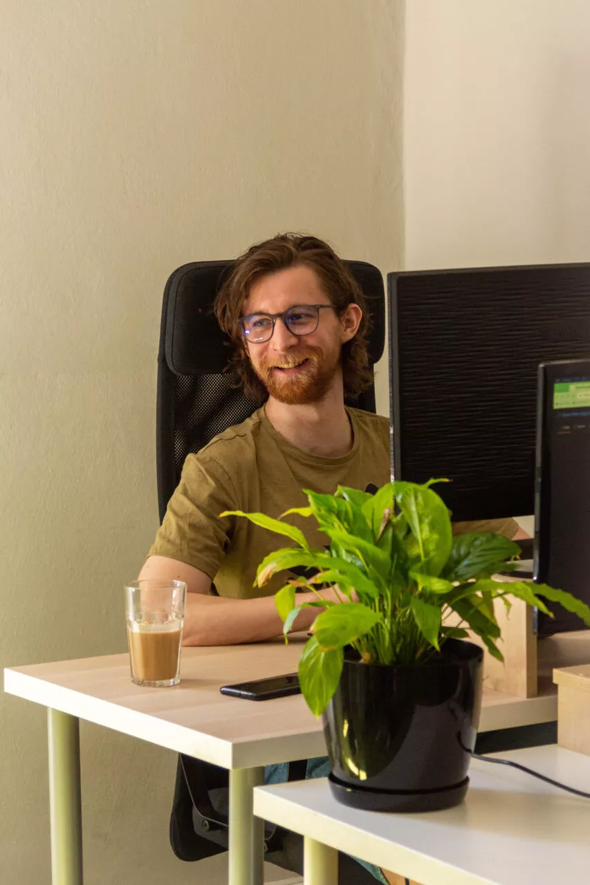 Web development - smiling programmer working on new project